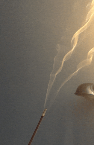 An animated GIF of smoke rising from a stick of incense.