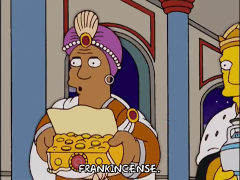 An animated GIF of Principal Skinner dressed as one of the biblical three kings offering frankincense.